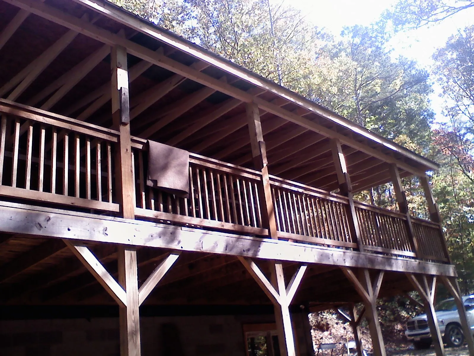 Timber framing under a new elevated porch and deck — Roof Leak Repair in Orem by Roofing Brothers
